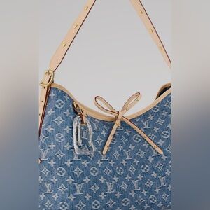 Brand new rare Carry on MM Authentic denim Louis  Vuitton purse. Limited edition